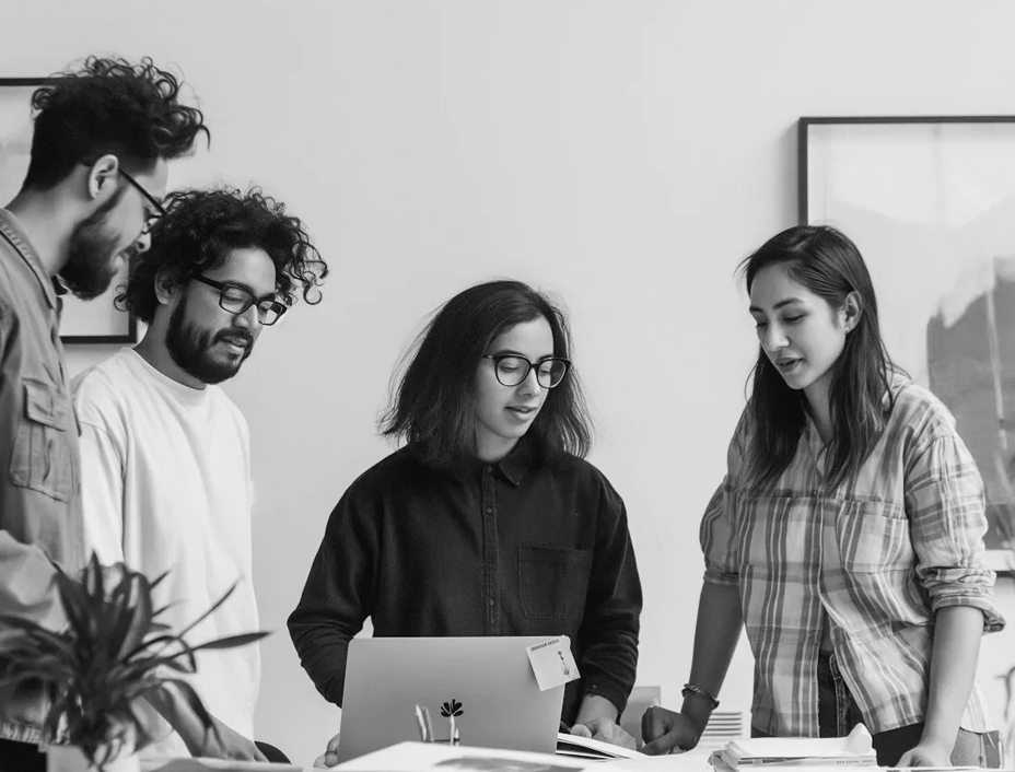 Group discussing digital innovation and UX/UI design at a branding agency.